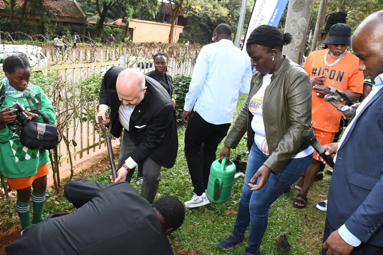 Stanbic Bank staff members planting trees during the campaign